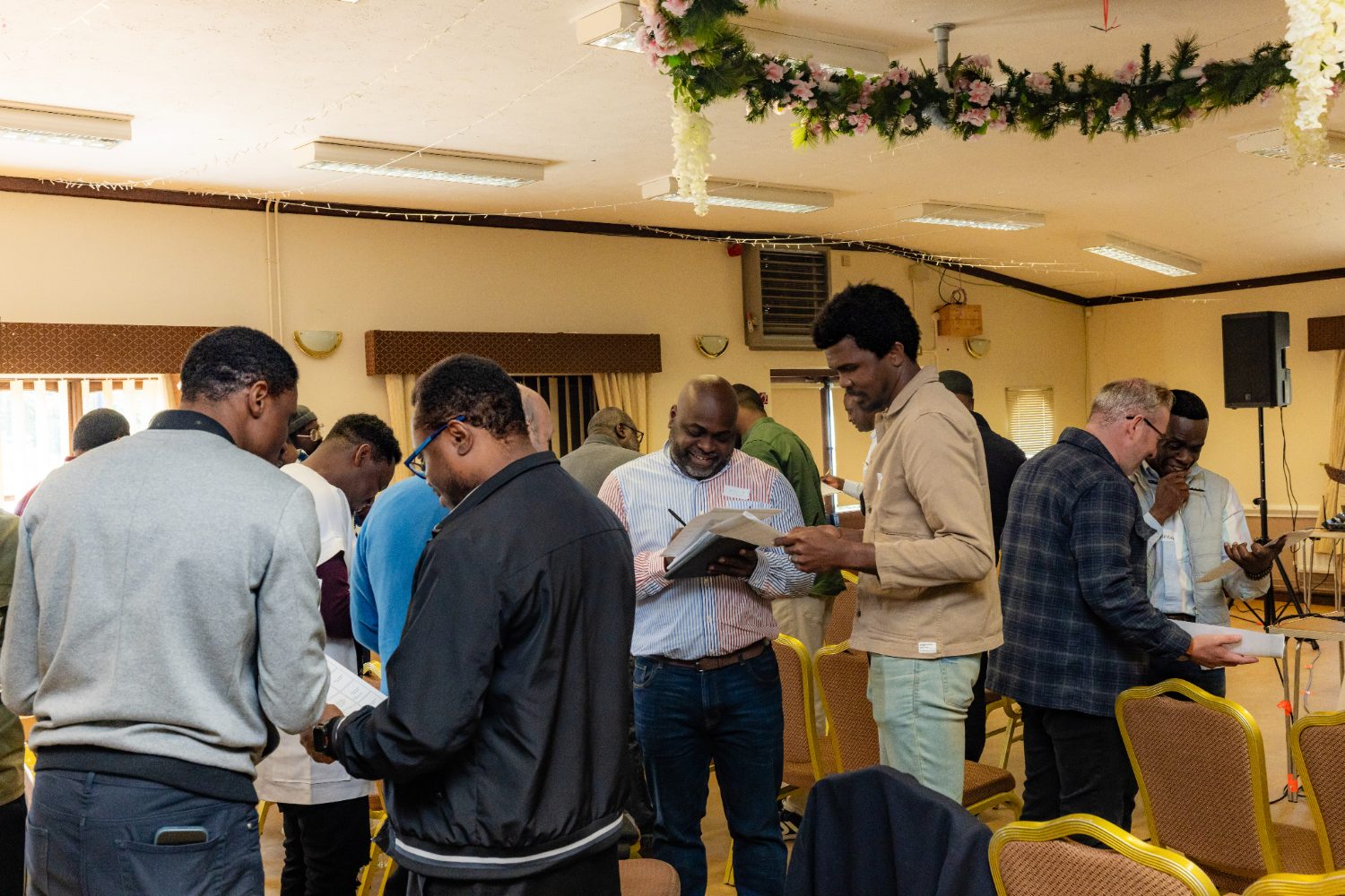 Men working through the session material at Withstand